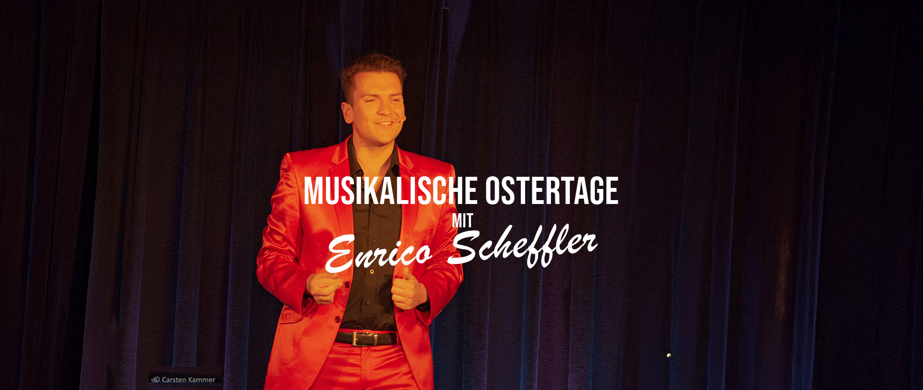 Bild mit einem bunten, wirbelnden Hintergrund und weißem Text, der 'Musikalische Ostertage mit Roger Whittaker Double' sagt. Rechts im Bild ist ein Hase zu sehen.